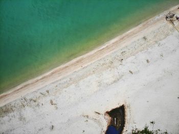 High angle view of abandoned wall by water