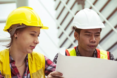 Low angle view of man working at construction site