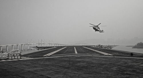 Helicopter flying in sky