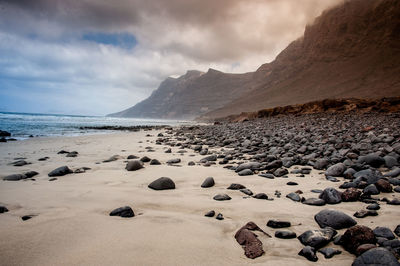 Scenic view of beach against sky