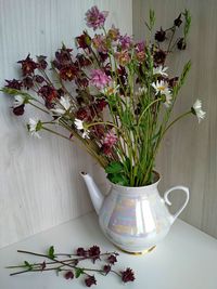 Close-up of flower vase on table