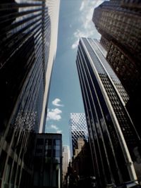 Low angle view of modern buildings against sky