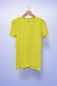 Yellow umbrella hanging on white background