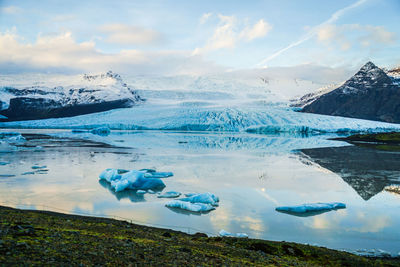 Scenic view of snowcapped mountains against sky