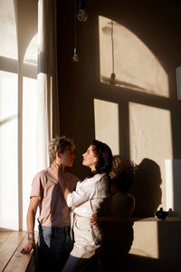 Couple embracing in spacious room