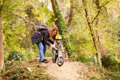 Rear view of two women in forest