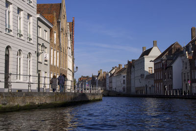 Canal passing through city buildings
