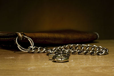 Close-up of chain on table