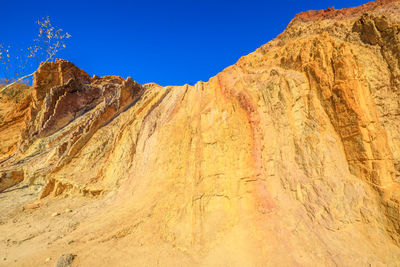 Scenic view of mountains against clear blue sky