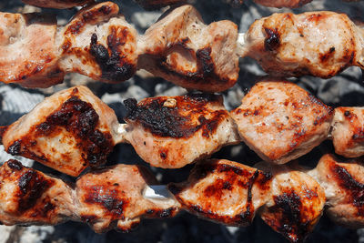 Close-up of meat on barbecue grill