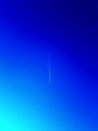 Vapor trail in clear blue sky