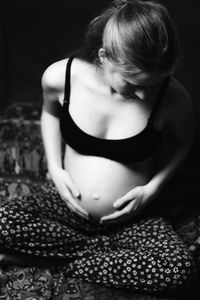 Close-up of woman touching at home