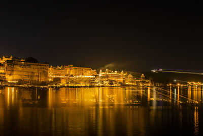 Illuminated city at waterfront