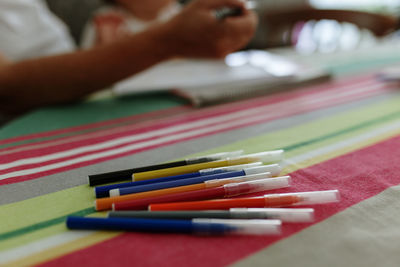 Close-up of felt tip pens on bed at home