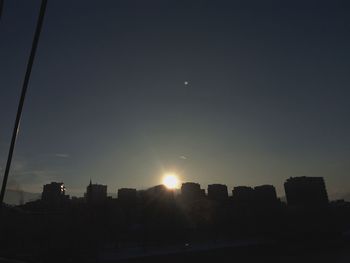 Cityscape against sky during sunset