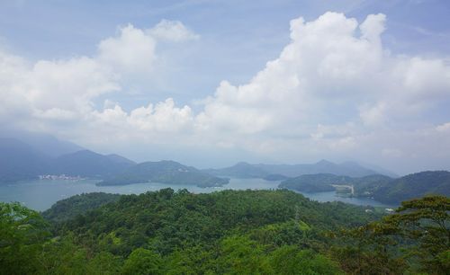 Scenic view of mountains against cloudy sky