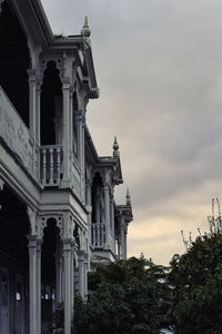 Low angle view of building against sky during sunset