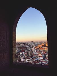 Cityscape seen through arch