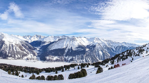 Scenic view of snowcapped mountains against sky