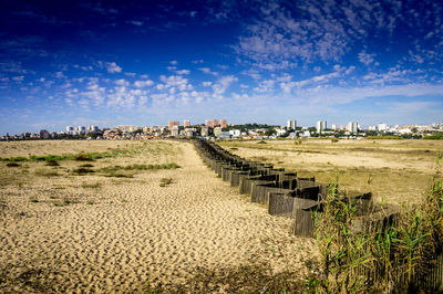 Panoramic shot of landscape against blue sky