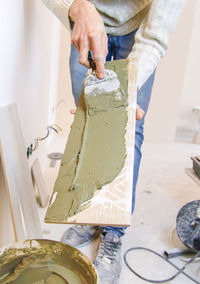 Cropped hands of man working at workshop