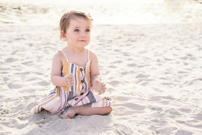 Portrait of cute girl playing at beach