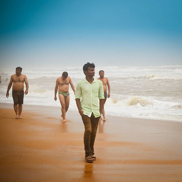 beach, sea, water, horizon over water, sand, shore, lifestyles, leisure activity, togetherness, clear sky, vacations, full length, men, copy space, walking, boys, standing, bonding, rear view