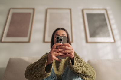 Young woman using mobile phone