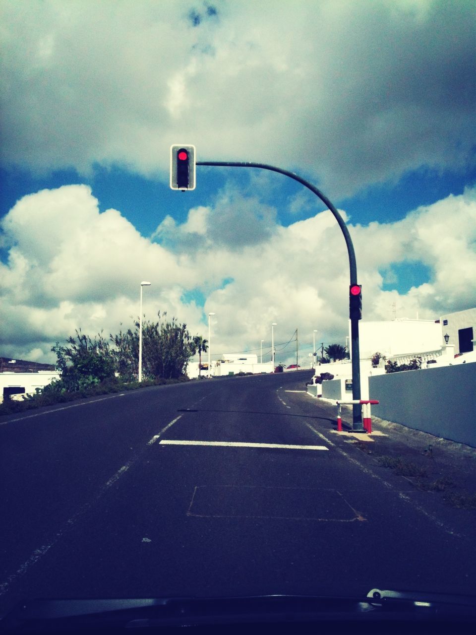 road, sky, transportation, road marking, cloud - sky, road sign, guidance, street, cloudy, car, the way forward, communication, arrow symbol, direction, cloud, street light, asphalt, day, directional sign, information sign