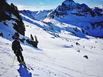 Man skiing on snowcapped mountain