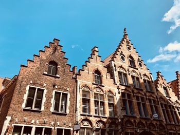 Low angle view of building against blue sky