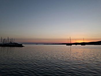 Scenic view of sea against clear sky at sunset