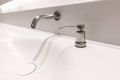 Close-up of faucet in bathroom