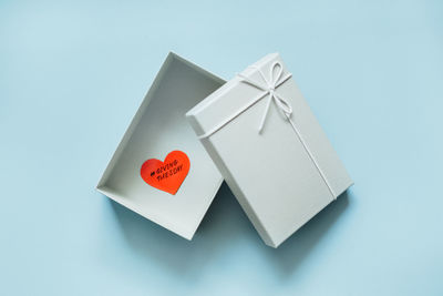Giving tuesday, time to give, help, donation, support, volunteer concept with red heart in gift box