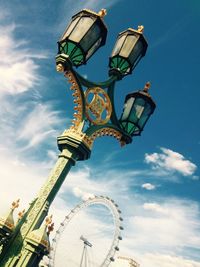 Low angle view of ferris wheel against sky