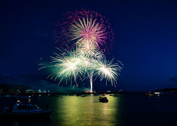 Firework display at night