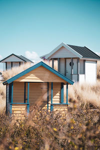 Wooden hut at skanör beach against clear blue sky.