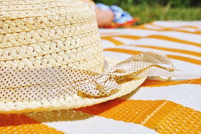 Close-up of hat on sand at beach