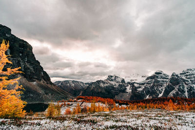 Scenic view of snowcapped mountains against sky during autumn