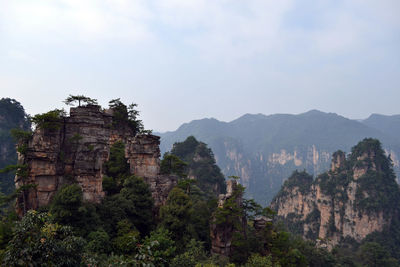 View of rock formation on mountain against sky