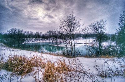 Scenic view of frozen lake against sky