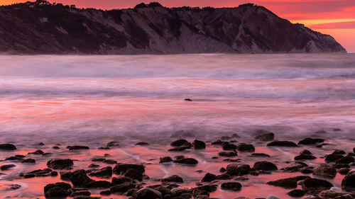 Scenic view of sea against sky during sunset