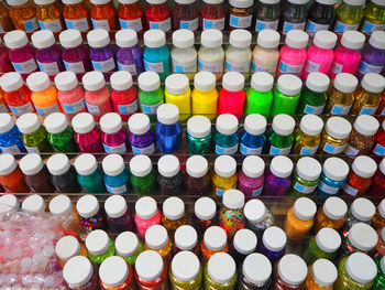 High angle view of multi colored confetti bottles for sale in shop