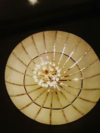 Directly below shot of illuminated pendant light hanging from ceiling