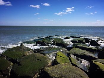 Scenic view of sea against cloudy sky