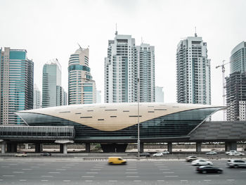 Modern buildings in city against sky