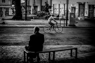 Woman standing on footpath