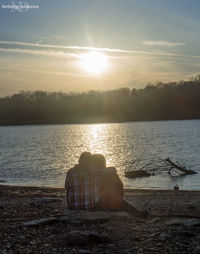 Scenic view of lake at sunset