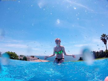 Man swimming in pool