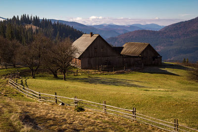 Abandoned house in carpathian mountains landscape photo